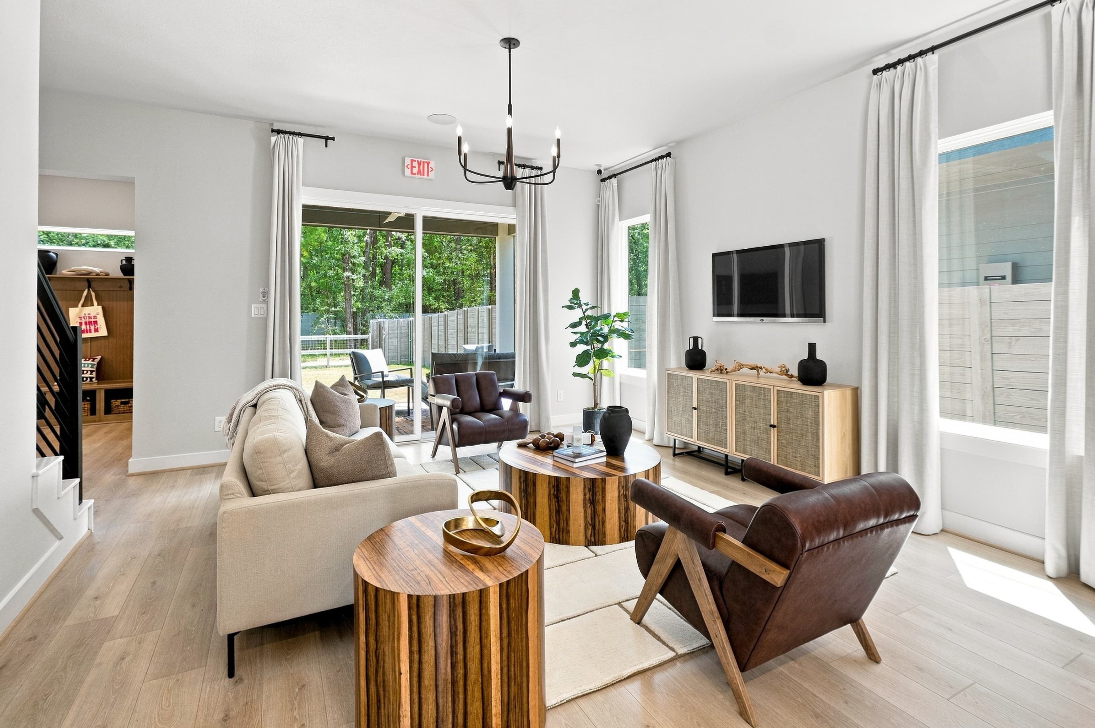 Living room with staircase view — 8102 Yall St